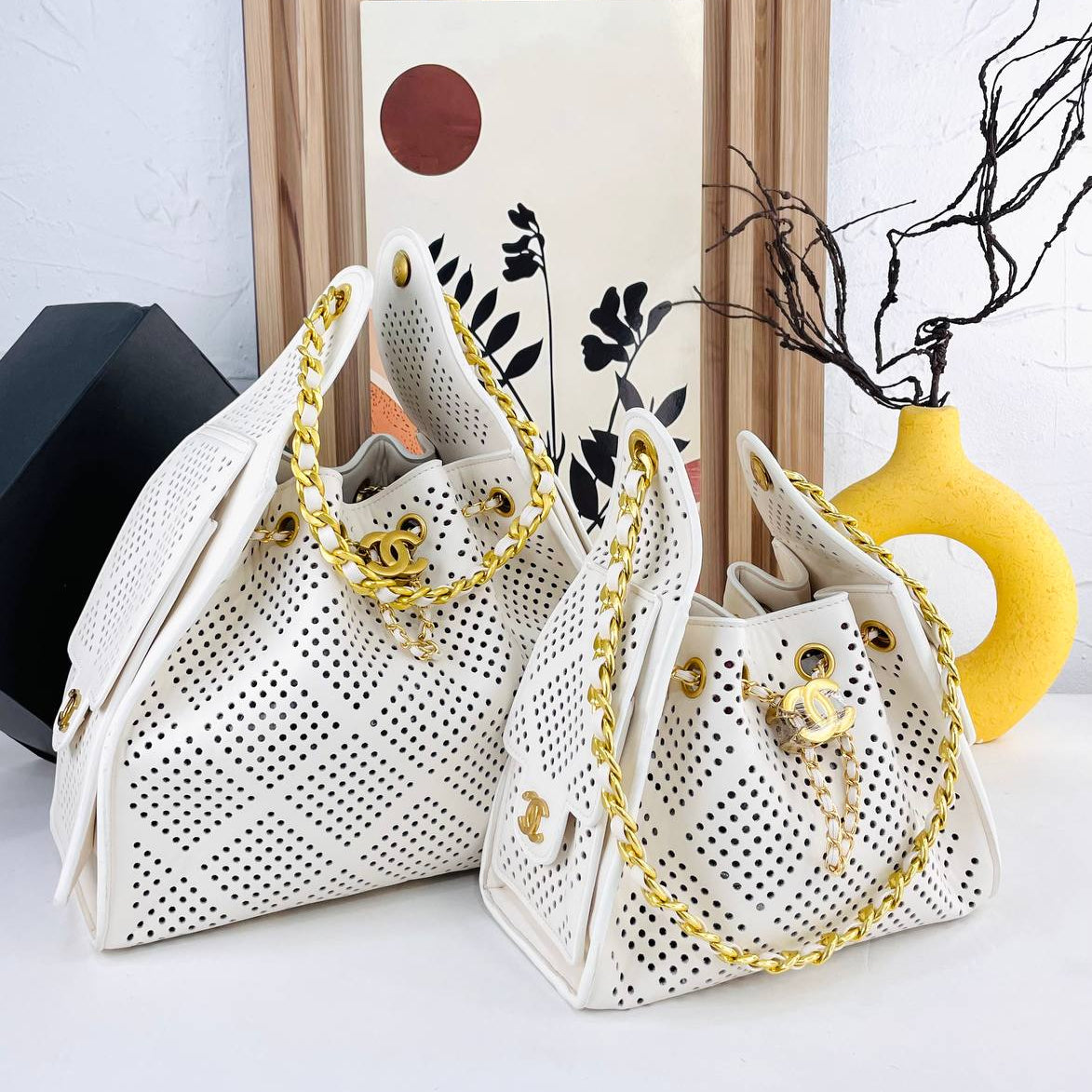 Chanel Perforated Leather Bucket Bag with Gold Chain