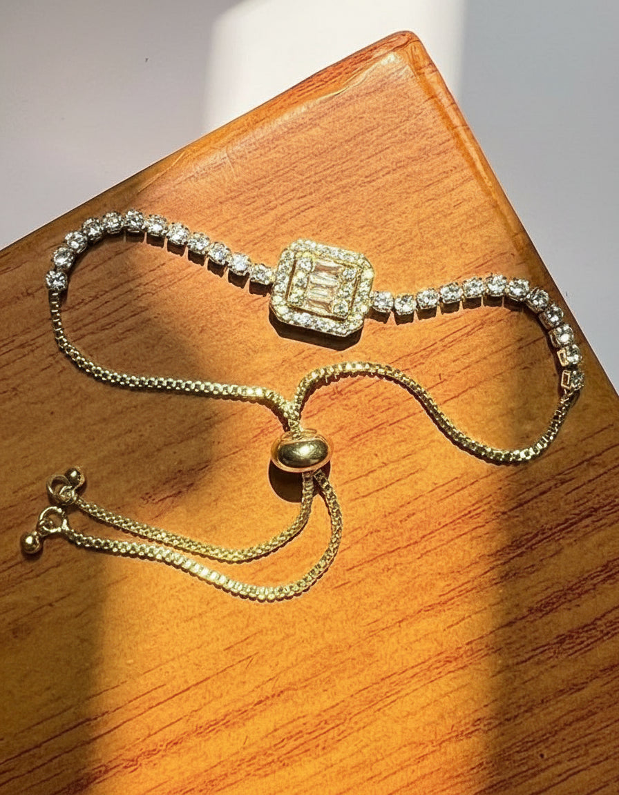 Adjustable Gold-Tone Tennis Bracelet with Baguette Centerpiece 🌟